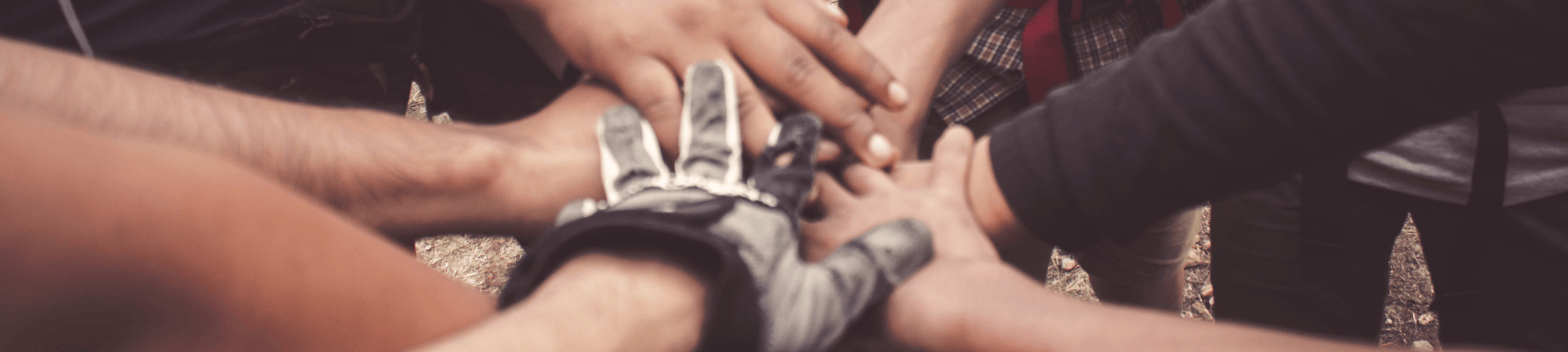 Team putting hands together