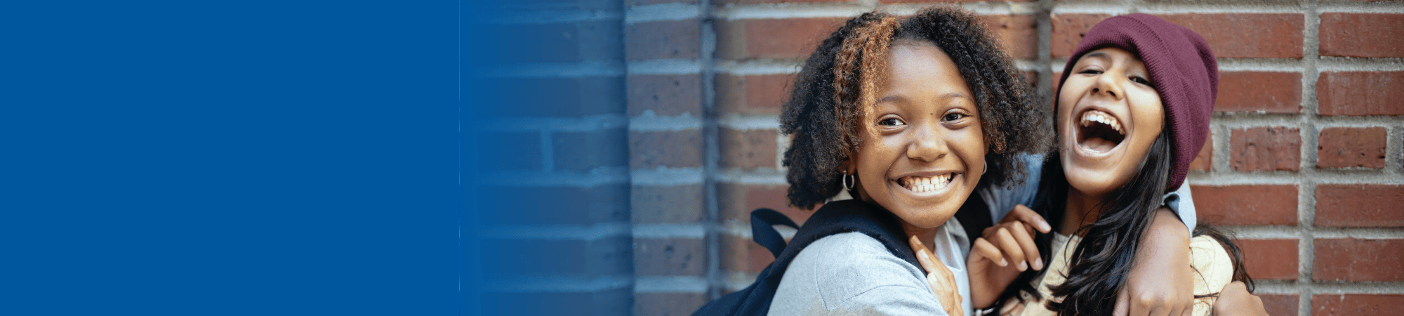 two teenagers laughing