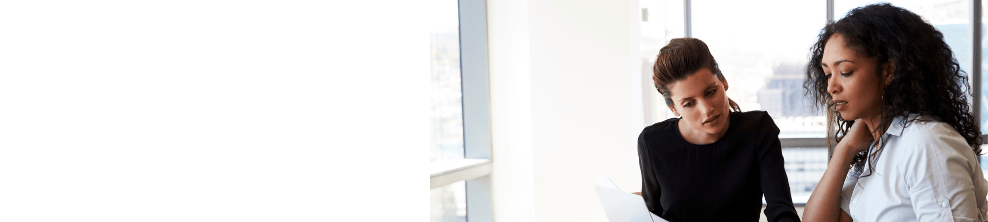 women working on computer together