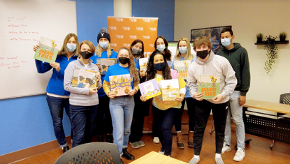 volunteers with books