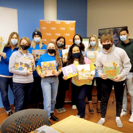 volunteers with books